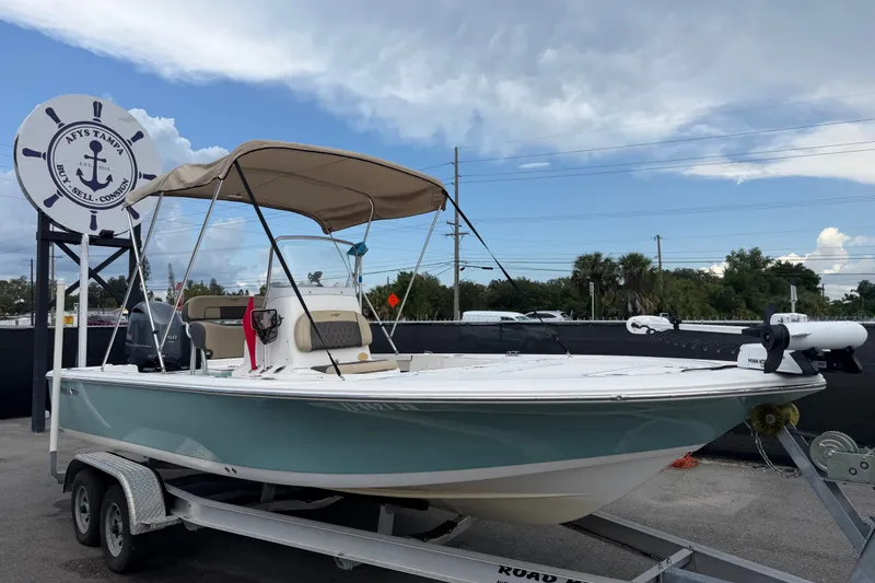 The Image of 2020 Tidewater 2110 Bay Max boat on trailer under blue sky. - 0