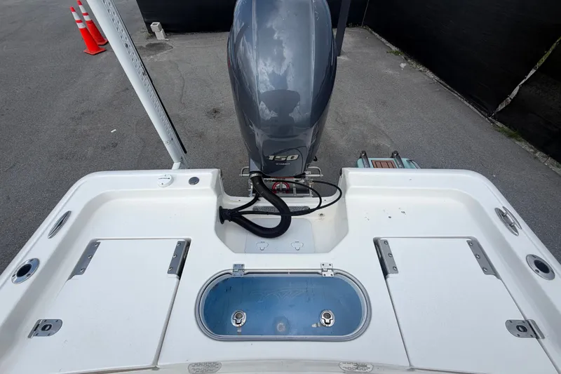 Slide: The Image of 2020 Tidewater 2110 Bay Max boat with 150 HP engine, rear deck view. - 58