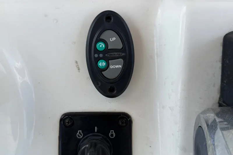 Slide: The Image of Control panel on a 2020 Tidewater 2110 Bay Max boat, featuring up and down buttons. - 20