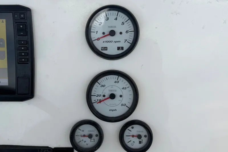 Slide: The Image of Dashboard gauges of a 2020 Tidewater 2110 Bay Max boat, featuring Yamaha instruments. - 19