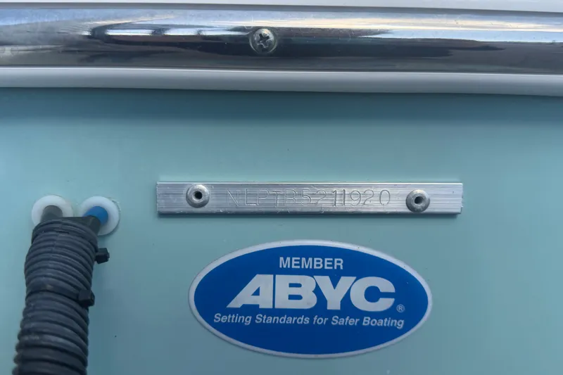 Slide: The Image of Close-up of 2020 Tidewater 2110 Bay Max boat with ABYC member plaque. - 62