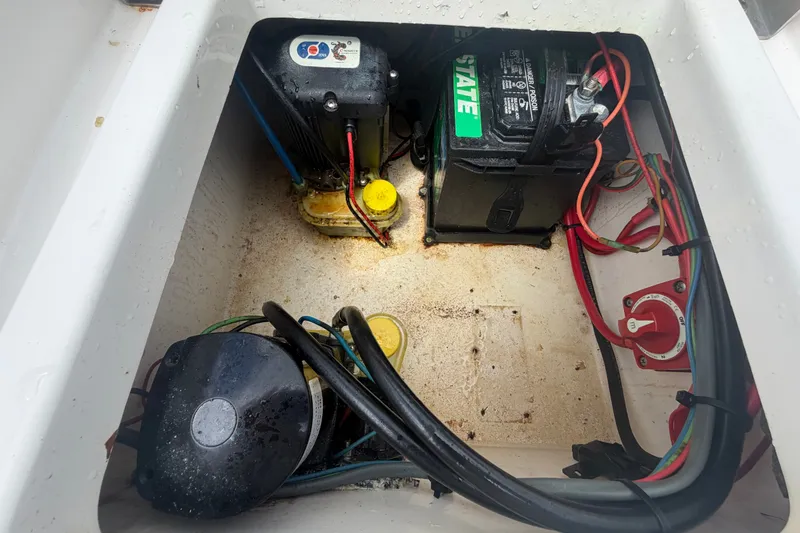 Slide: The Image of 2020 Tidewater 2110 Bay Max boat battery compartment with wiring and components. - 52