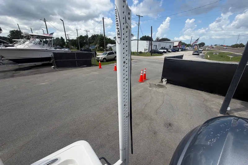 Slide: The Image of 2020 Tidewater 2110 Bay Max boat in a parking lot with traffic cones and other boats nearby. - 61