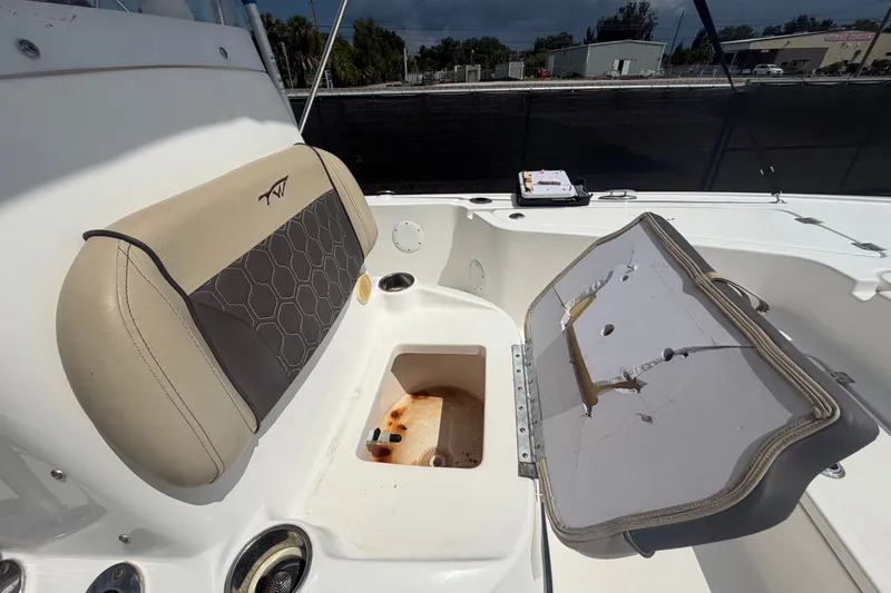 Slide: The Image of 2020 Tidewater 2110 Bay Max boat interior with open storage compartment. - 43