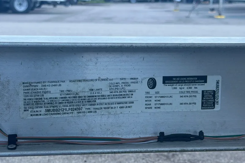 Slide: The Image of Label on a 2020 Tidewater 2110 Bay Max trailer, detailing tire and load specifications. - 64