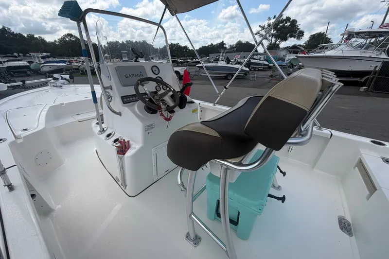 Slide: The Image of 2020 Tidewater 2110 Bay Max boat interior with Garmin navigation system and seating. - 13