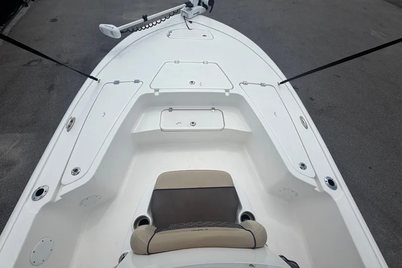 Slide: The Image of 2020 Tidewater 2110 Bay Max boat interior with seating and storage compartments. - 26