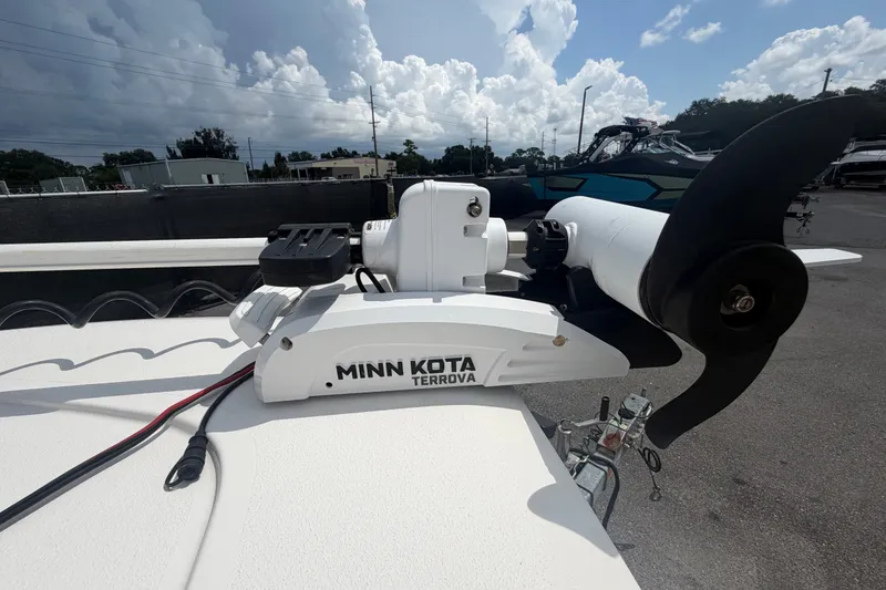 Slide: The Image of Minn Kota Terrova trolling motor on 2020 Tidewater 2110 Bay Max boat under cloudy sky. - 37