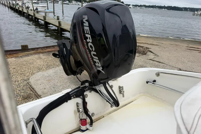 Slide: The Image of 2017 Boston Whaler 130 Super Sport with Mercury outboard motor at dockside. - 6