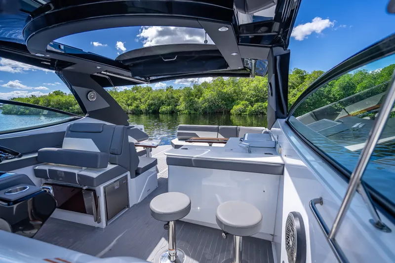 Slide: The Image of 2022 Cruisers Yachts 38 GLS OB interior with luxurious seating and scenic water view. - 24