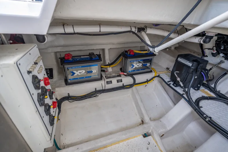 Slide: The Image of 2022 Cruisers Yachts 38 GLS OB engine compartment with batteries and wiring. - 26