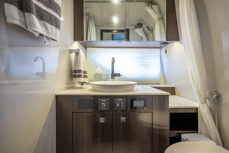 Slide: The Image of Luxurious bathroom interior of 2022 Cruisers Yachts 38 GLS OB with modern fixtures and elegant design. - 35