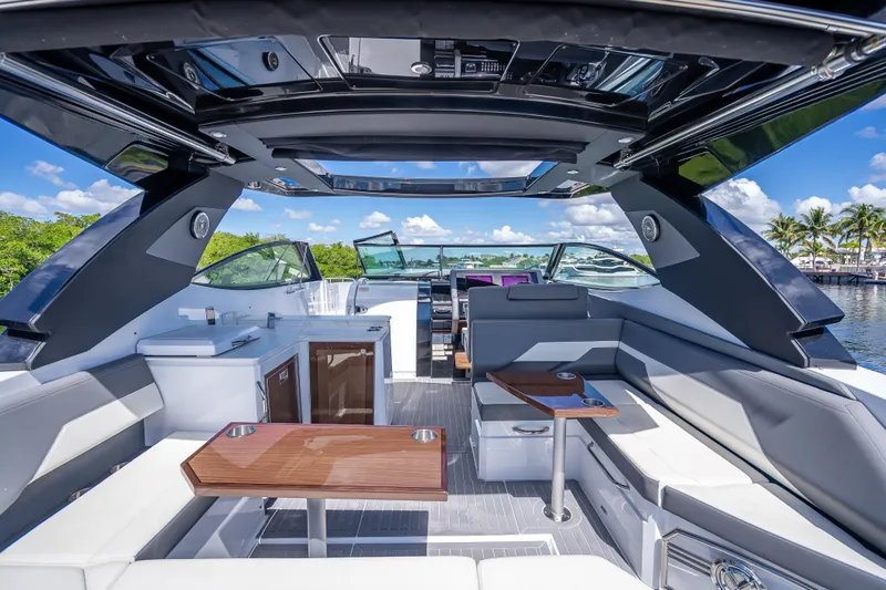 Slide: The Image of 2022 Cruisers Yachts 38 GLS OB interior with luxurious seating and modern amenities. - 20