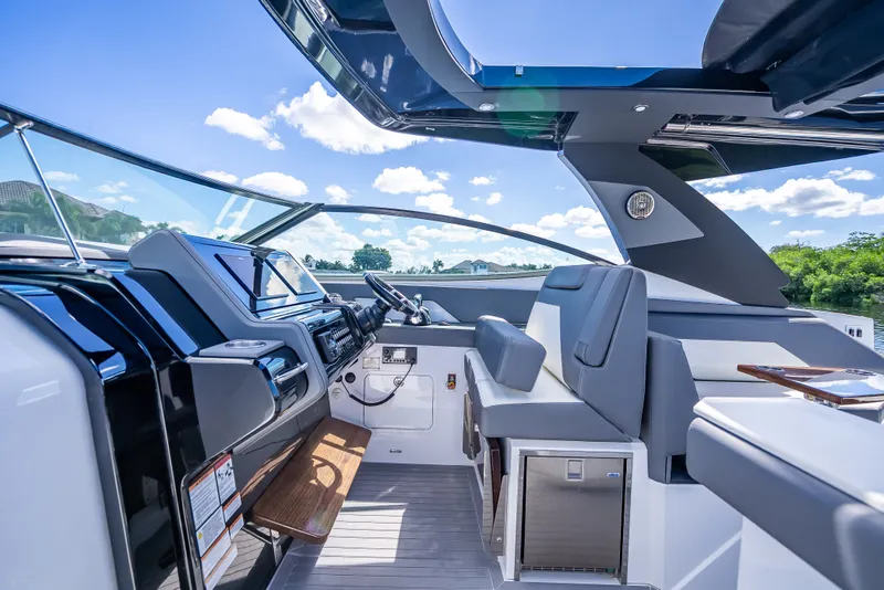 Slide: The Image of Luxurious 2022 Cruisers Yachts 38 GLS OB cockpit with modern helm and seating. - 22