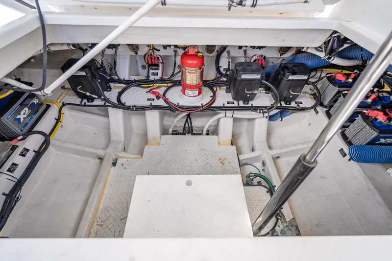 Slide: The Image of Engine compartment of 2022 Cruisers Yachts 38 GLS OB with wiring and fire extinguisher. - 27
