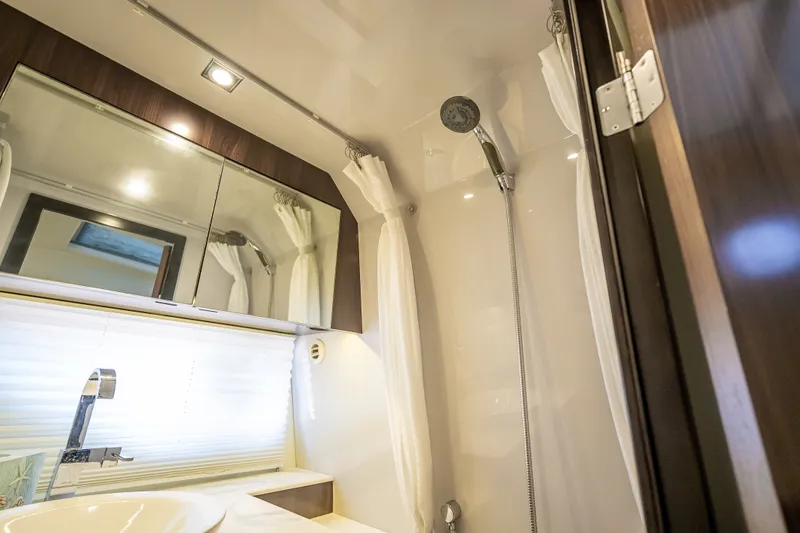 Slide: The Image of Luxurious bathroom interior of 2022 Cruisers Yachts 38 GLS OB with modern fixtures. - 17