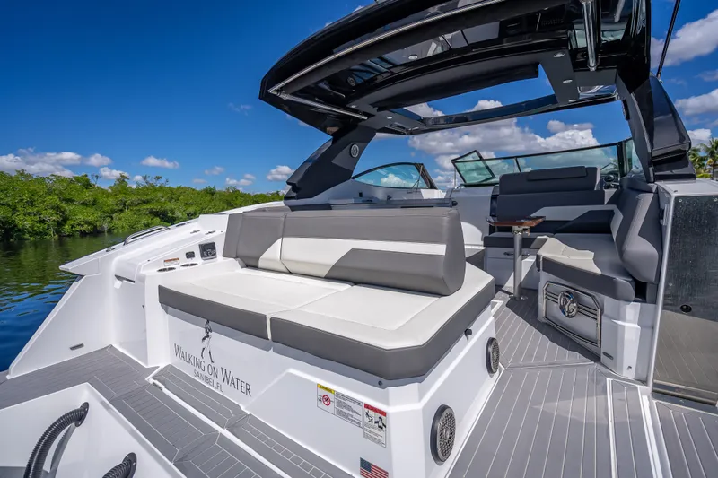 Slide: The Image of 2022 Cruisers Yachts 38 GLS OB interior with sleek seating and open deck design. - 28