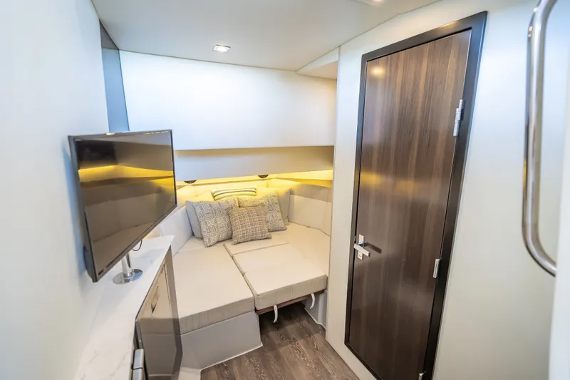 Slide: The Image of Interior cabin of 2022 Cruisers Yachts 38 GLS OB with modern decor and TV. - 14
