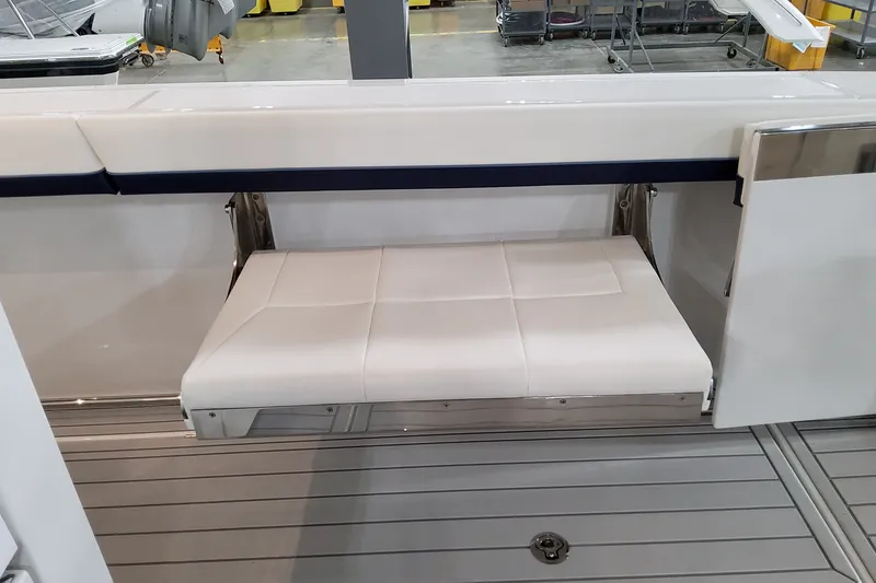 Slide: The Image of 2026 Formula 387 Center Console Fish boat with foldable white seat on deck. - 27