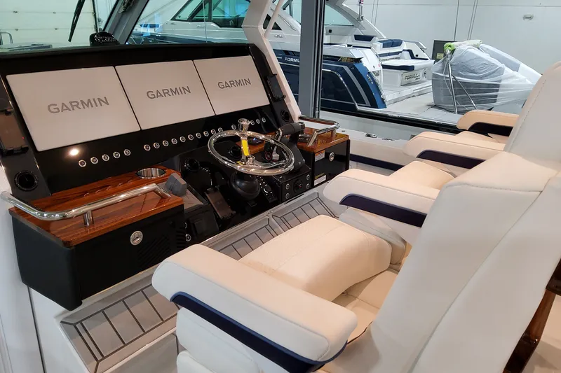 Slide: The Image of Interior of 2026 Formula 387 Center Console Fish with Garmin navigation displays. - 19