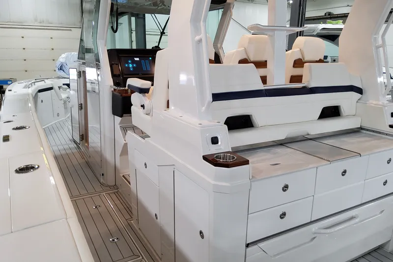 Slide: The Image of 2026 Formula 387 Center Console Fish boat interior with sleek seating and modern controls. - 13