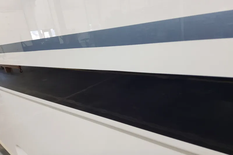 Slide: The Image of Close-up of 2026 Formula 387 Center Console Fish boat hull with blue stripe. - 4