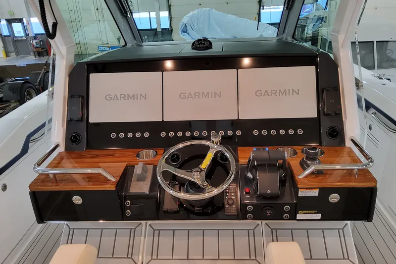 Slide: The Image of Helm of 2026 Formula 387 Center Console Fish with Garmin displays and controls. - 18