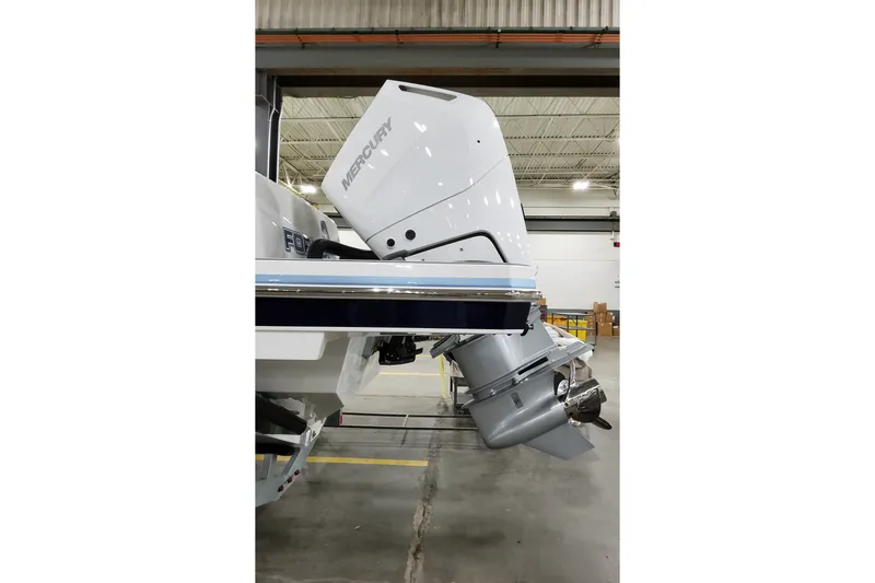 Slide: The Image of 2026 Formula 387 Center Console Fish boat with Mercury outboard engine in a warehouse. - 9