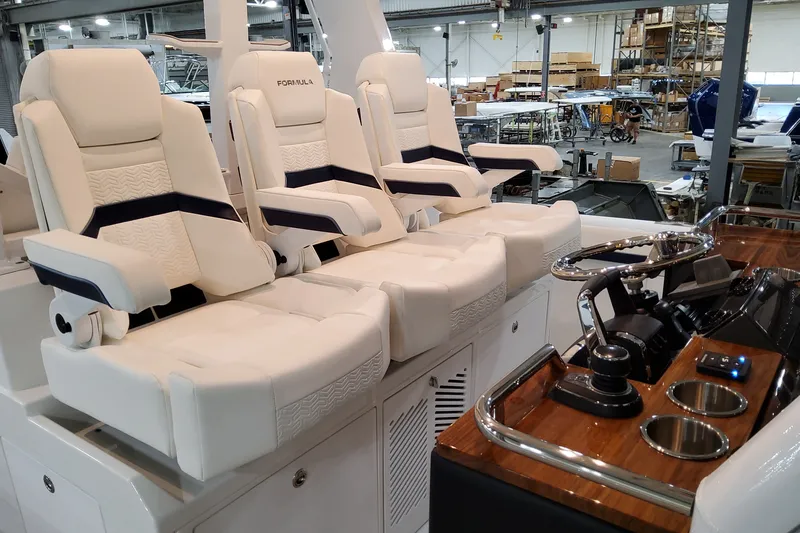 Slide: The Image of 2026 Formula 387 Center Console Fish boat interior with luxurious seating and modern helm controls. - 20