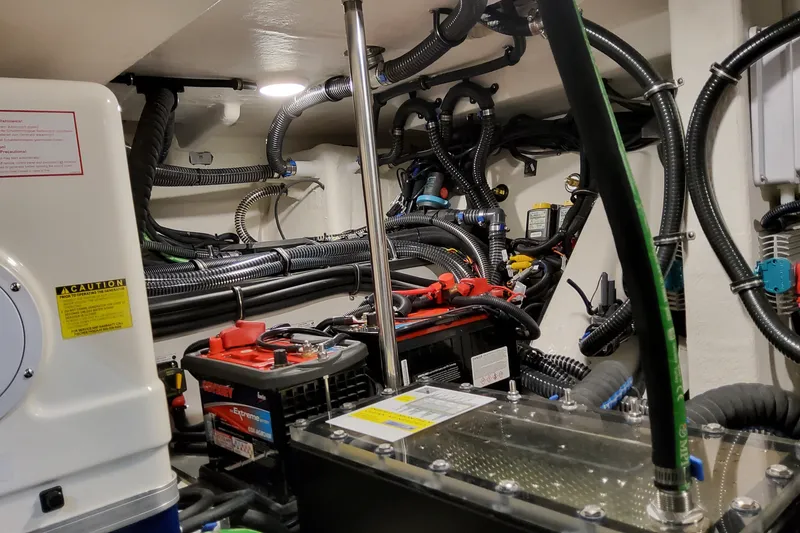 Slide: The Image of Engine room of 2026 Formula 387 Center Console Fish, showcasing wiring and battery setup. - 30