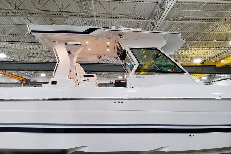 Slide: The Image of 2026 Formula 387 Center Console Fish boat in a warehouse setting. - 3