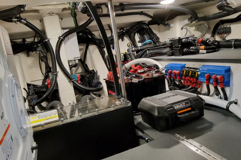 Slide: The Image of Engine room of 2026 Formula 387 Center Console Fish, showcasing wiring and equipment. - 32