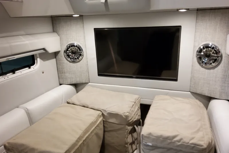 Slide: The Image of Interior of 2026 Formula 387 Center Console Fish with TV and cushioned seating. - 22
