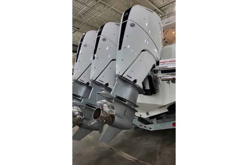 Slide: The Image of Triple outboard motors on a 2026 Formula 387 Center Console Fish boat. - 8