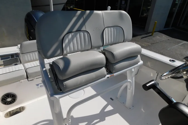 Slide: The Image of 2021 Sea Fox 228 Commander boat seating with cushioned helm chairs and console. - 23