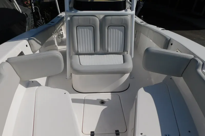Slide: The Image of 2021 Sea Fox 228 Commander boat interior with white seating and storage compartments. - 7