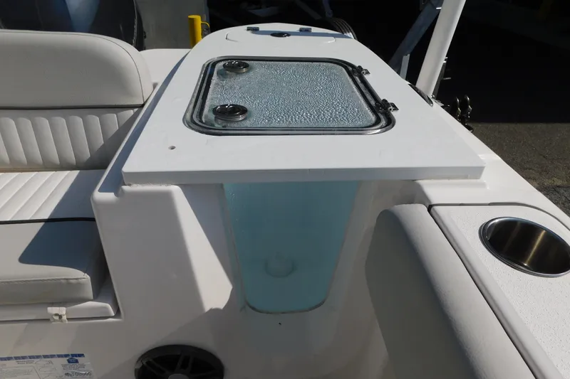 Slide: The Image of 2021 Sea Fox 228 Commander boat interior with seating and storage compartment. - 9