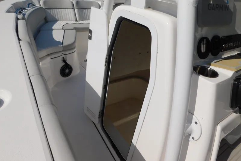 Slide: The Image of 2021 Sea Fox 228 Commander boat interior with open cabin door and seating area. - 14