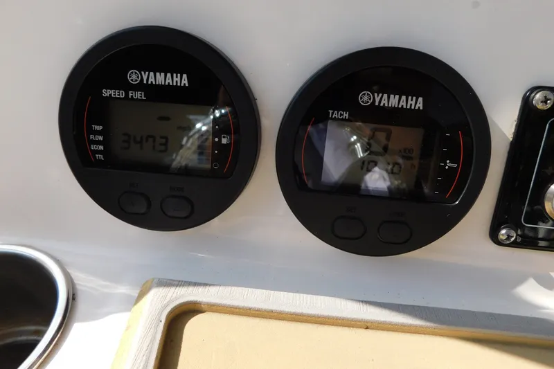 Slide: The Image of Yamaha gauges on 2021 Sea Fox 228 Commander boat dashboard, displaying speed and tachometer. - 18