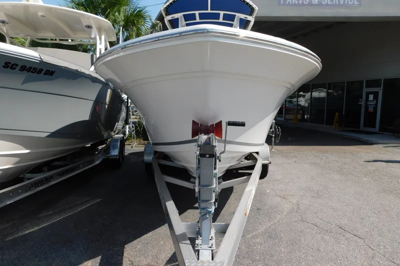 Slide: The Image of 2021 Sea Fox 228 Commander boat on trailer, parked outside a service center. - 17