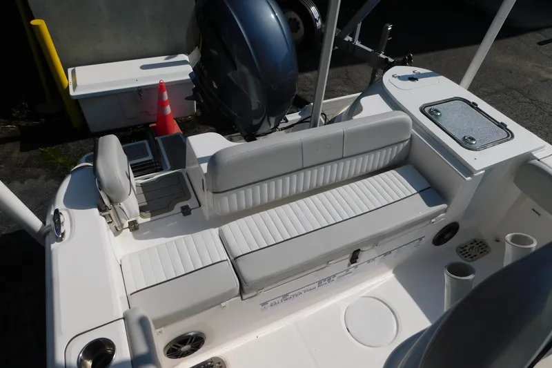 Slide: The Image of 2021 Sea Fox 228 Commander boat interior with seating and storage compartments. - 6