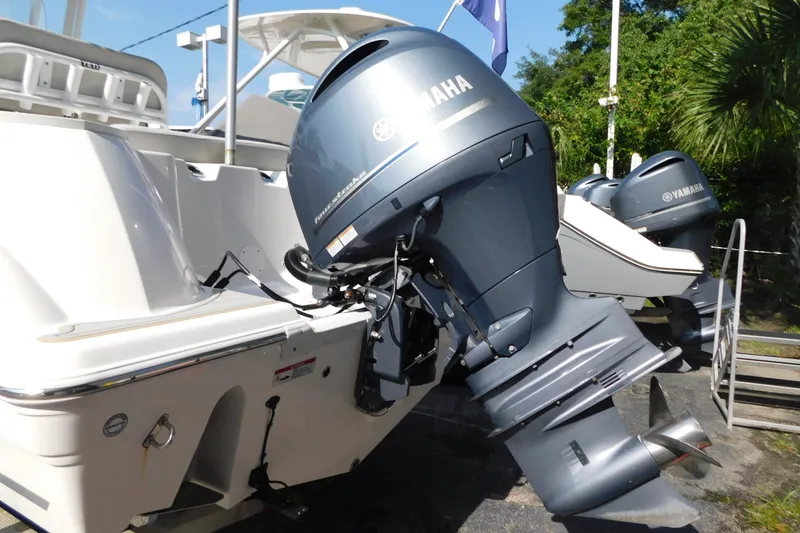 Slide: The Image of 2021 Sea Fox 228 Commander with Yamaha outboard engines, docked outdoors. - 8