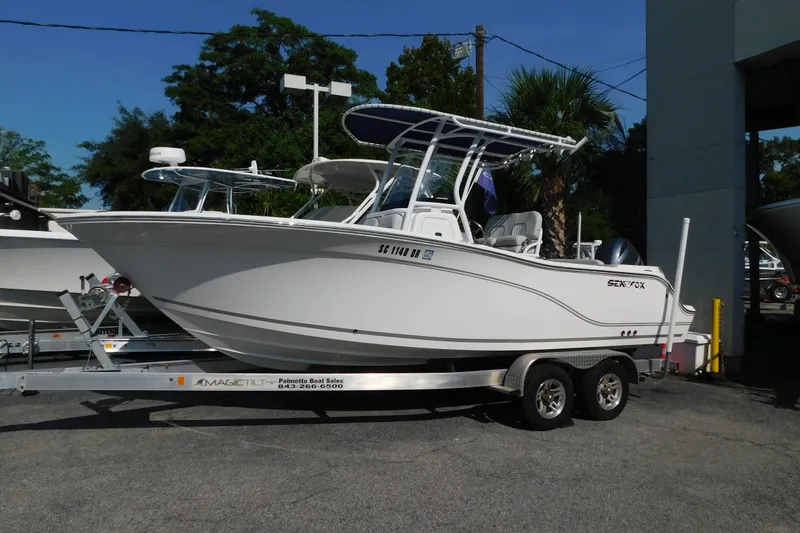 The Image of 2021 Sea Fox 228 Commander boat on trailer, parked outdoors. - 0