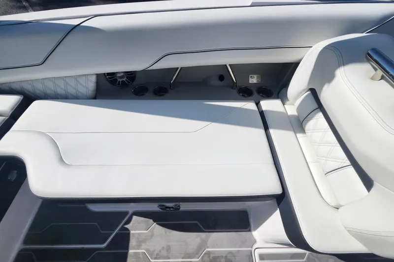 Slide: The Image of Luxurious white seating in a 2022 Regal LS6 boat interior. - 11