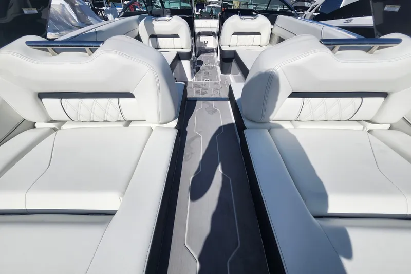 Slide: The Image of 2022 Regal LS6 boat interior with luxurious white seating and modern design. - 9