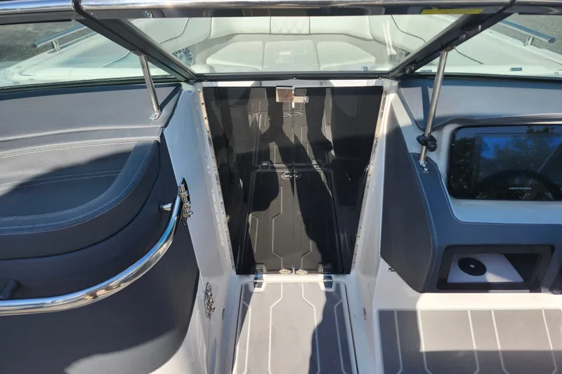 Slide: The Image of 2022 Regal LS6 boat interior with sleek seating and modern dashboard design. - 20