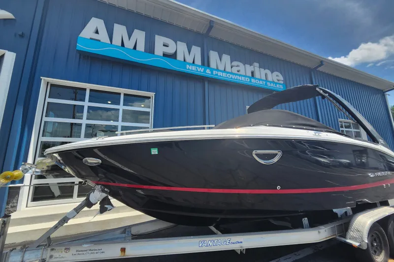 Slide: The Image of 2022 Regal LS6 boat on trailer at AM PM Marine dealership. - 1