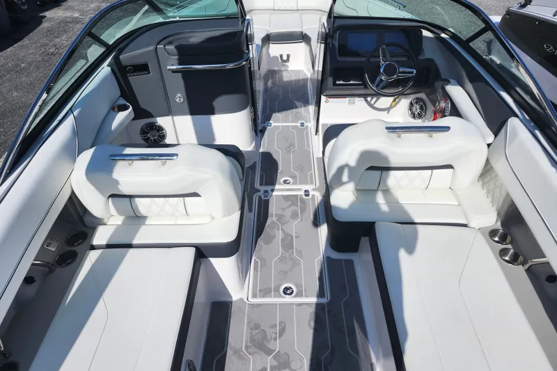 Slide: The Image of 2022 Regal LS6 boat interior with white seating and modern dashboard design. - 10