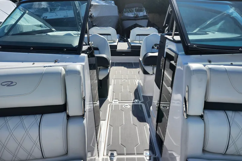 Slide: The Image of 2022 Regal LS6 boat interior with luxurious seating and modern design. - 23