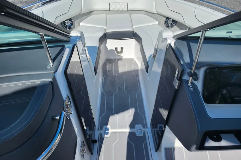 Slide: The Image of Interior view of a 2022 Regal LS6 boat, featuring sleek seating and modern design. - 19
